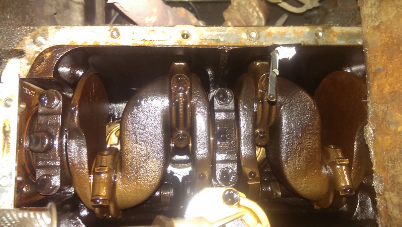 Bottom end with oil pan off. One of the strangest crankshaft designs.